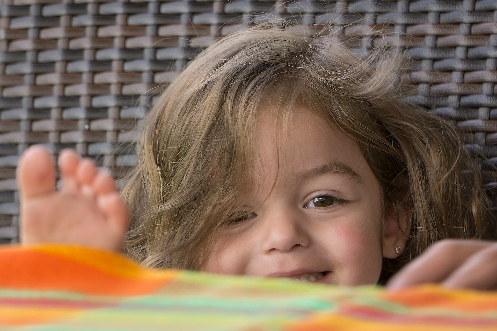 a child lying on a bed